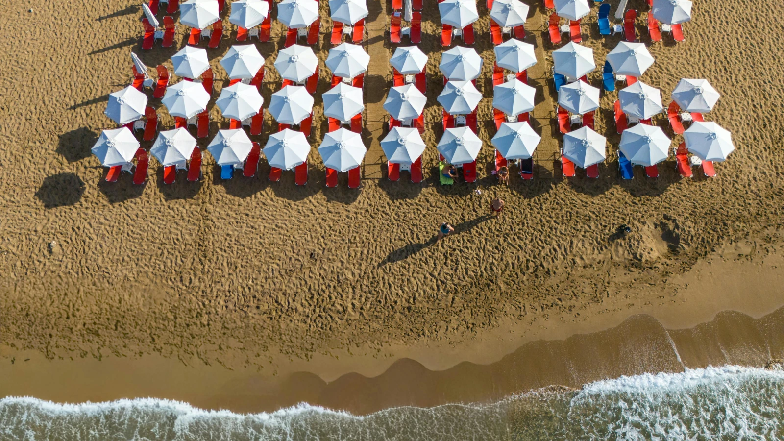 Finikoudes Beach promenade Larnaka with palm trees and seafront for car hire visitors